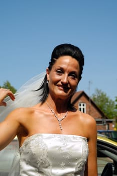 A happy bride in a white dress