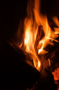 Closeup fireplace with burning fire woods.