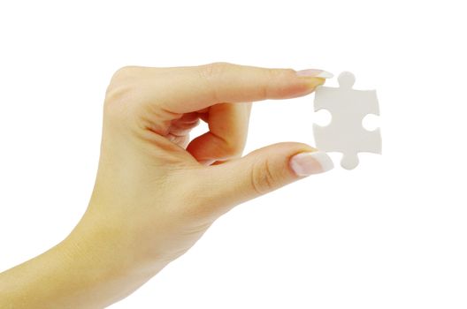 hand holding a puzzle piece