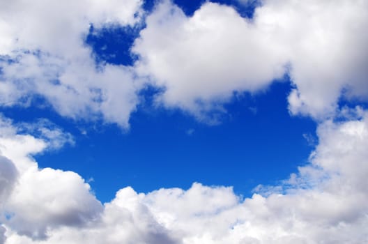 blue sky background with tiny clouds