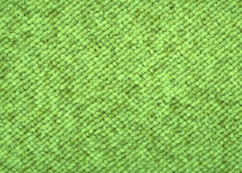 Sample piece of a Loop-woven carpet in a modern green color tone. A useful picture for architects and people doing home decorations or a nice texture background for related subjects.
