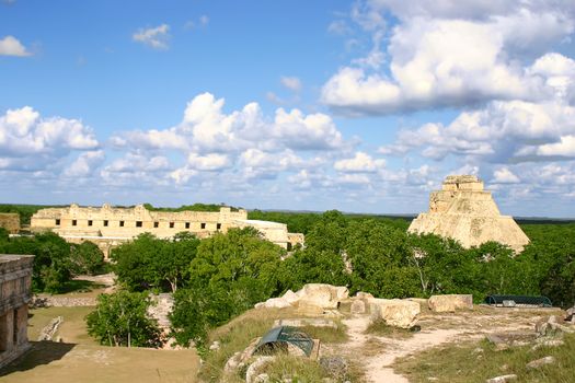 Maya ruins Uxmal in mexican Yucatan with green forest