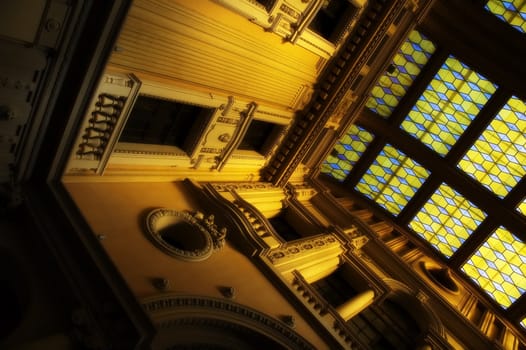 Classical building interior with golden light and soft focus