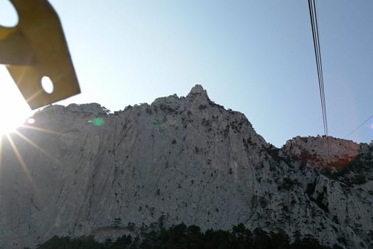 Sun above peak of AyPetri mountain in the Crimea, 1234,2 m