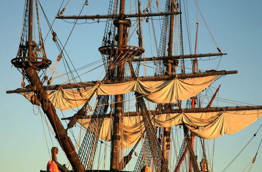 Details of sail – Batavia – historic galleon by sunset. Old ship. Flevoland, Netherlands.