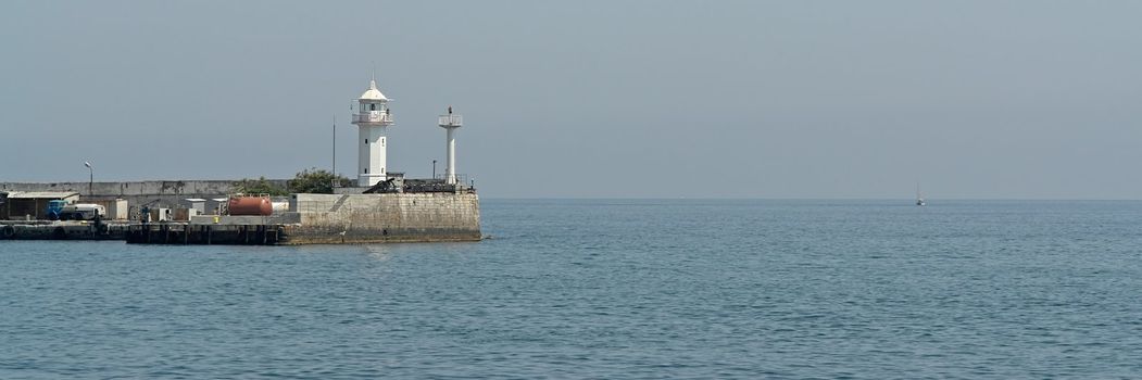 Small lighthouse on the pier in the Yalta bunch.