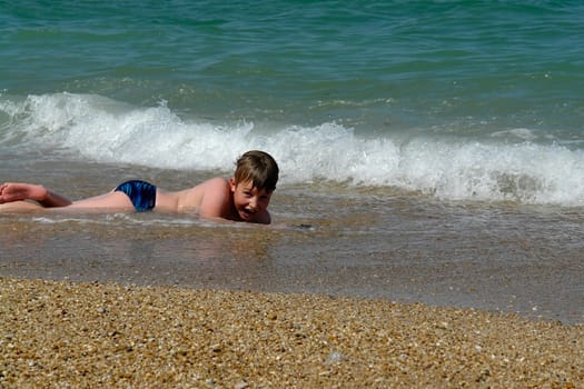 Boy At Beach. Happy vacation moment at the beach.