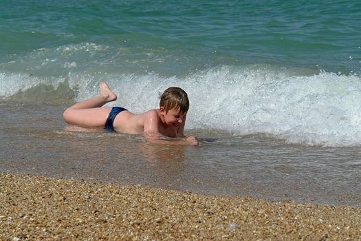 Boy At Beach. Happy vacation moment at the beach.