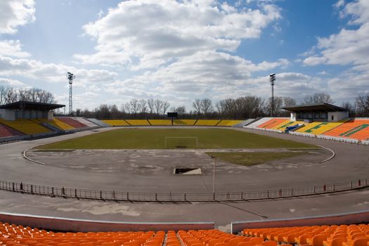 Empty sport stadium with blue sky at background