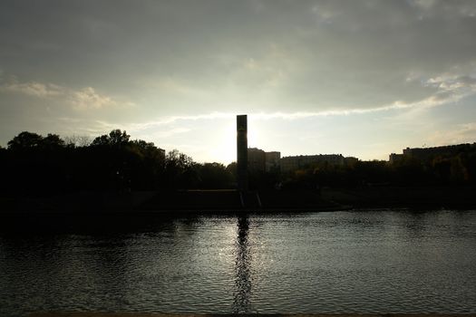 Reflection in the river with sunset at background