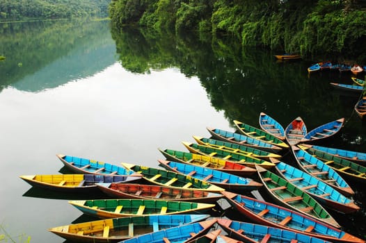 Colorful tour boats at the lakeside of the Fewa Lake, Nepal