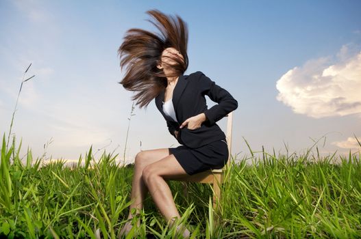 Outdoor Fashion businesswoman tossing her hair in air