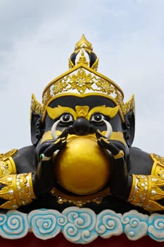 The moon in Rahoo mouth at Wat Saman, Thailand