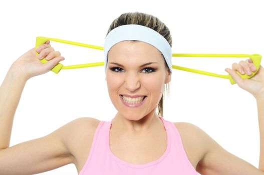 athletic woman doing gymnastic exercises with an elastic fitness