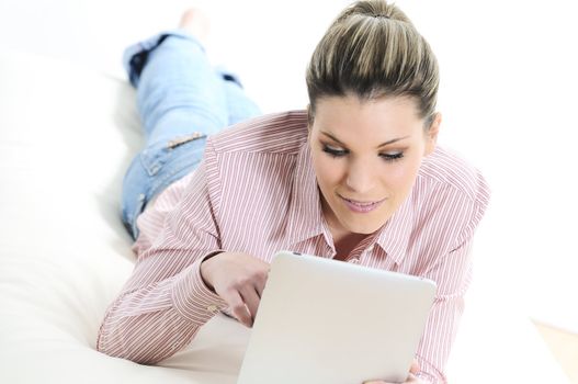 Young woman surfing on his digital tablet