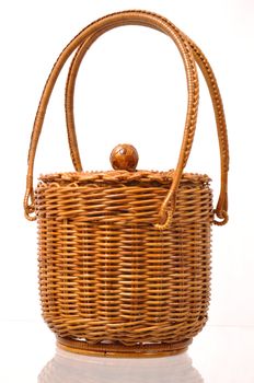 An empty wicker basket isolated on a white background