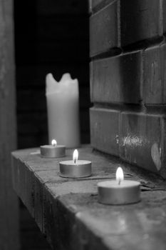 White black foto maded  about candles on fireplace