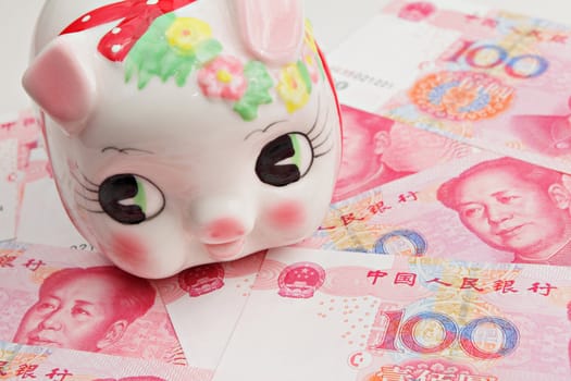 piggy bank on china banknote