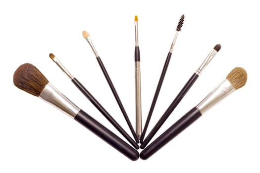 a set of seven brushes for applying makeup