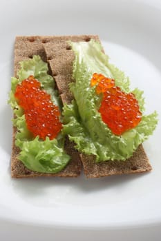 toasts with caviar on a plate