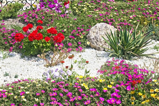 bed with blooming flowers with design elements