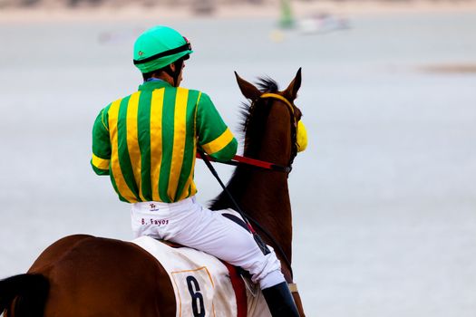 SANLUCAR DE BARRAMEDA, CADIZ, SPAIN - AUGUST 07: Unknown rider at the start of the horses races of the beach of Sanlucar de Barrameda on August 07, 2010 in Sanlucar de Barrameda, Cadiz, Spain.