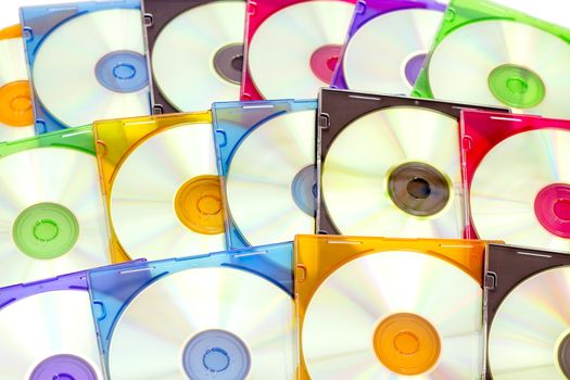 colorful CDs in boxes lined in a row