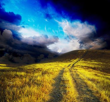 path on mountain meadow in nice day