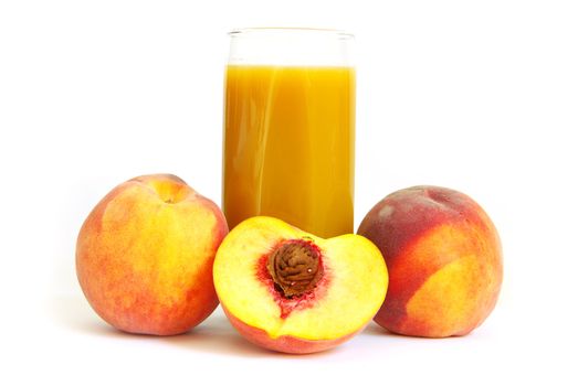 Glass with freshly made peach juice on a white background