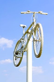 sports bike painted in white on a pole