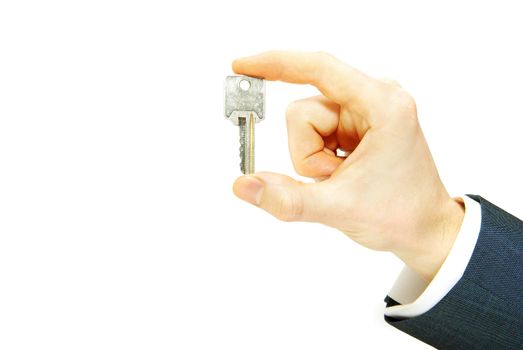 hand holds a key isolated on white