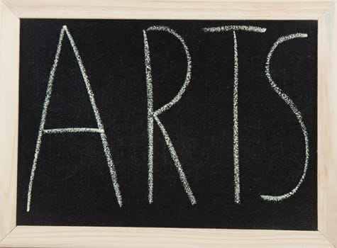 A black board with a wooden frame and the word 'ARTS' written in chalk.