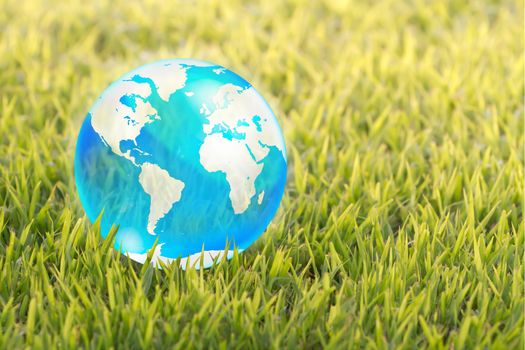 blue crystal globe on green background