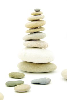 Stack of balanced stones on a white background