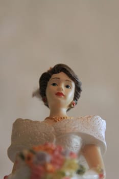 Antique figurine close up over background.