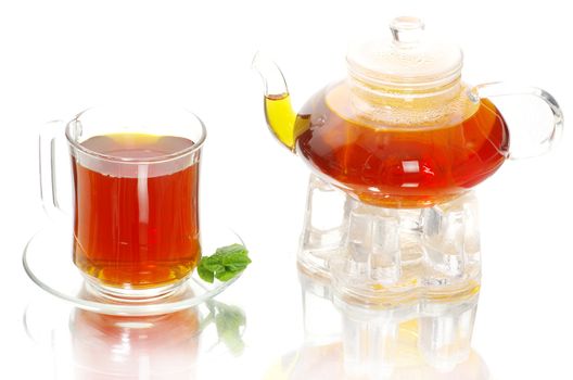 Tea being poured into glass tea cup