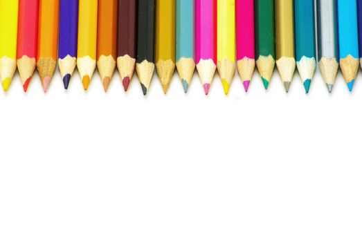  Assortment of coloured pencils  on white background