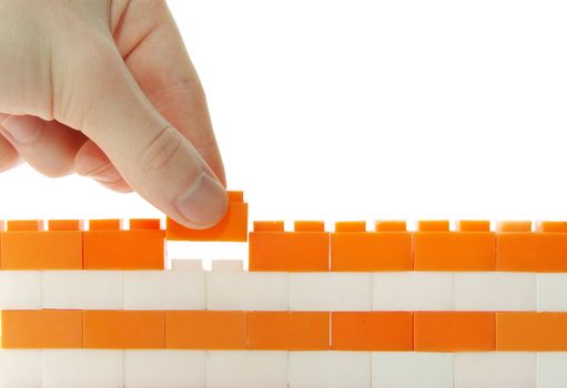 compleeting the wall on a white background