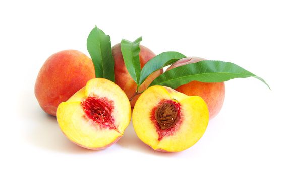 Fresh peach fruits isolated on white background