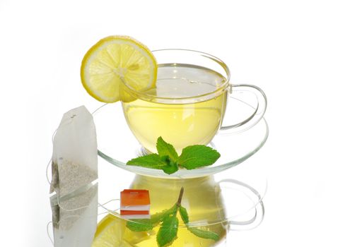 tea in cup with leaf mint  isolated on white background