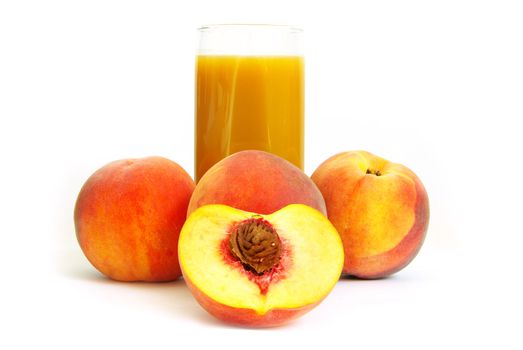 Glass with freshly made peach juice on a white background