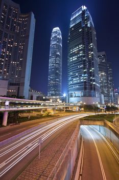 Busy night traffic in business district of modern city