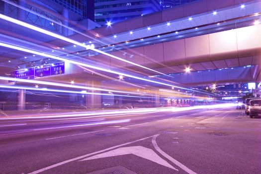 Busy night traffic in business district of modern city