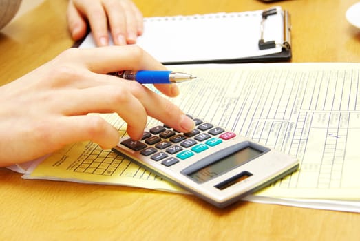 businesswoman writes a pen on an empty paper