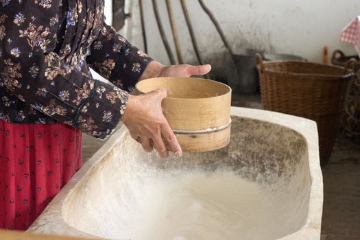 Traditional flour shifting.