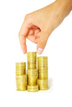 Hand put coin to money staircase isolated on white background