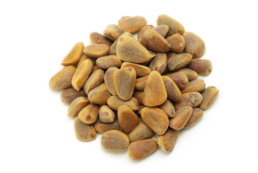 Brown cedar nuts fruit on white background