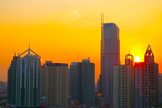 Shanghai sunset with skyscrapers background