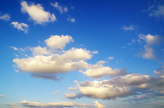 blue sky background with tiny clouds