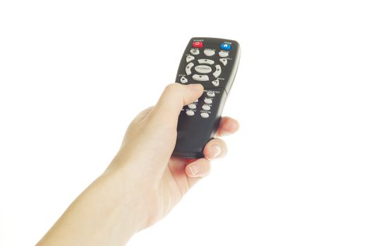 A hand holding a remote control isolated over a white background
